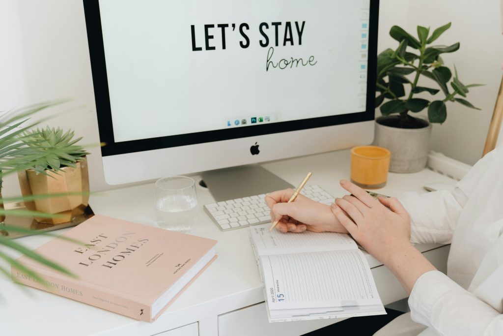Cozy desk setup with a gratitude journal and pen for daily reflections
